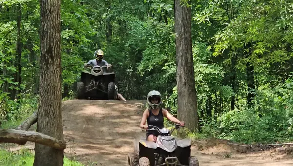 Riders on a wooded ATV trail at NJ ATV Rentals