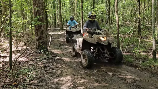 Quad riders cruising a sandy trail at NJ ATV Rentals
