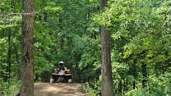 Riders on a wooded ATV trail at NJ ATV Rentals