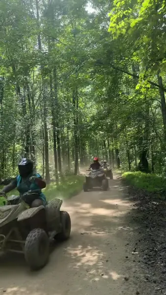 Quad riders cruising a sandy trail at NJ ATV Rentals