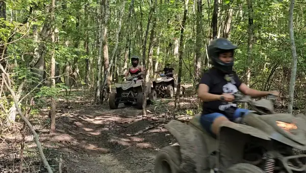 ATV group riding through the woods at NJ ATV Rentals