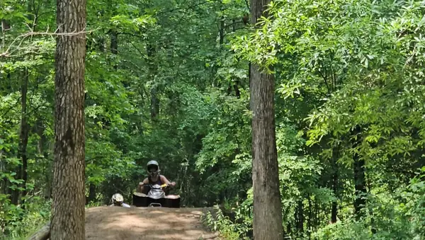 Smiling riders on an NJ ATV tour at NJ ATV Rentals