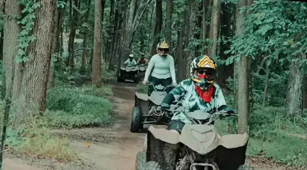 Quad riders cruising a sandy trail at NJ ATV Rentals